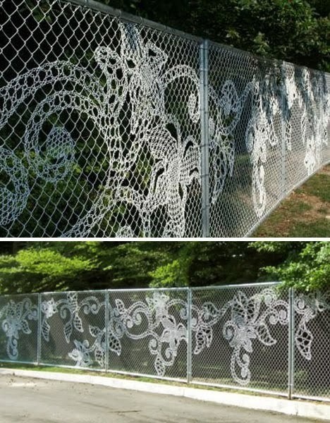 Chain link fence with patterns of flowers incorporated